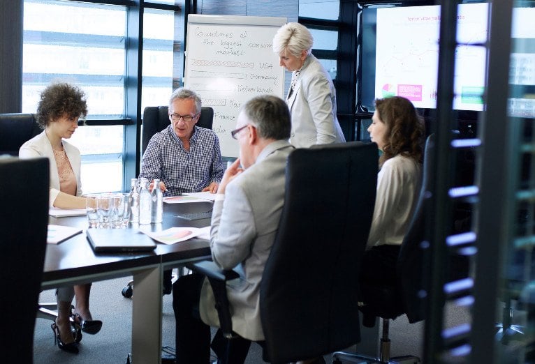 Business professionals engaged in a meeting room session.