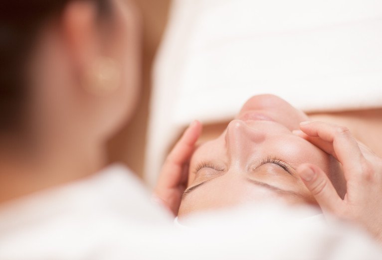 Close-up of a relaxing facial treatment at a spa.