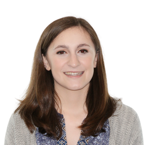 Smiling woman with long hair and a patterned top.