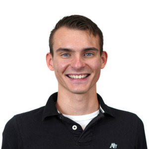 Smiling man in black polo, transparent background, headshot.