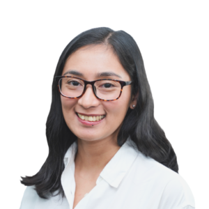 Headshot of smiling woman with black-framed glasses and brunette hair.