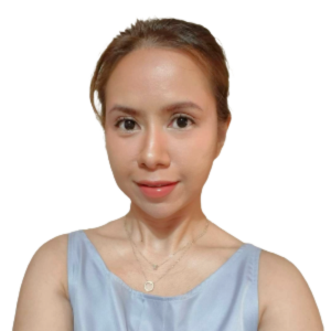 a woman is wearing a blue tank top and a necklace .