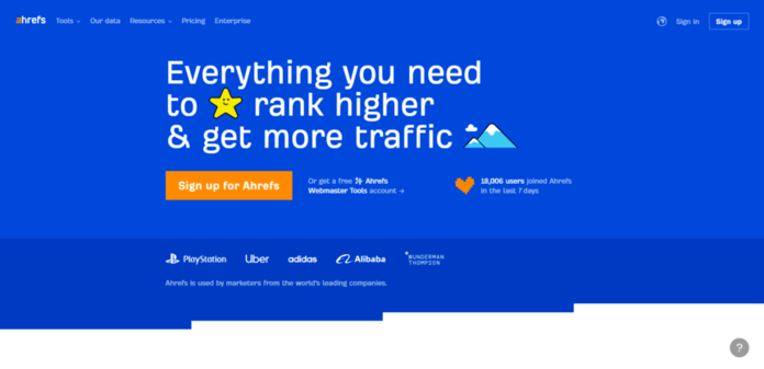 a blue sign up page for ahrefs that says everything you need to rank higher and get more traffic