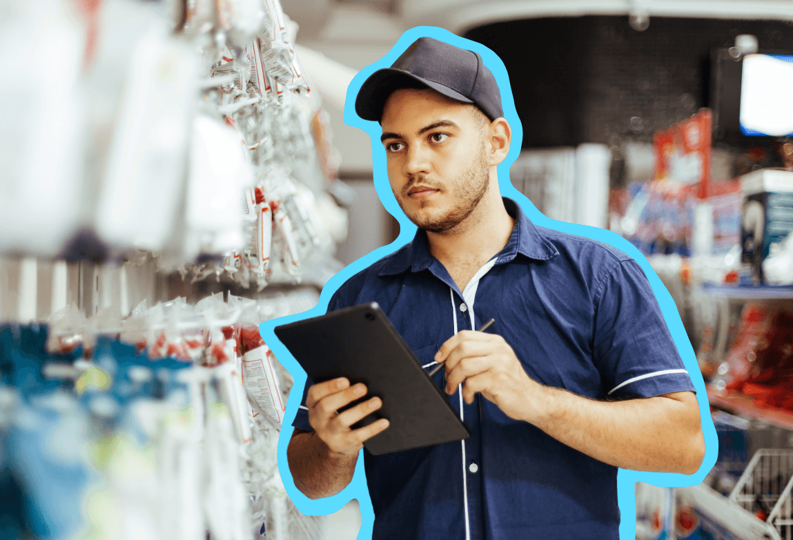 Man in a blue shirt and ball cap holding a checklist and pen