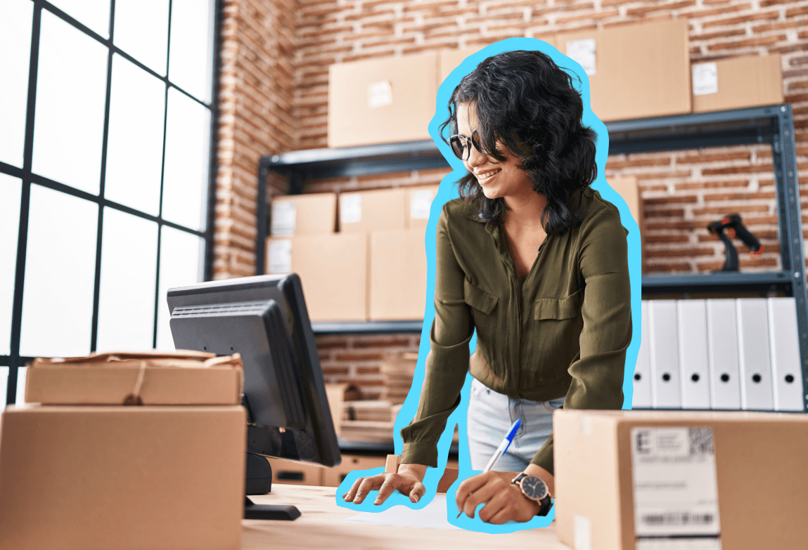 Woman in a store looking at a computer