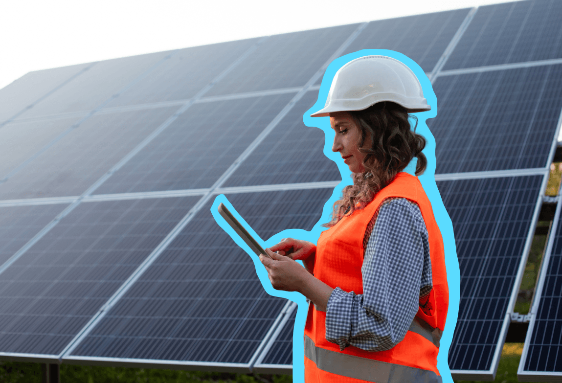 Energy worker looking at solar panels