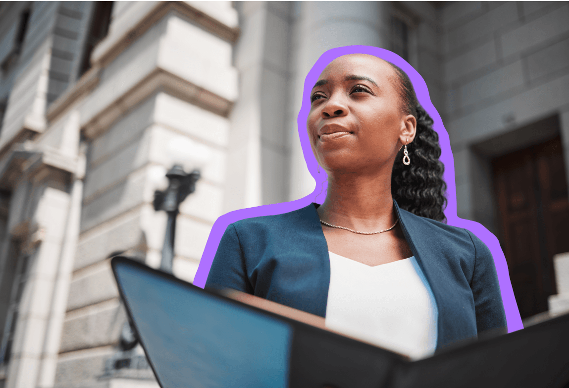 Black woman in a suit standing in front of a courthouse
