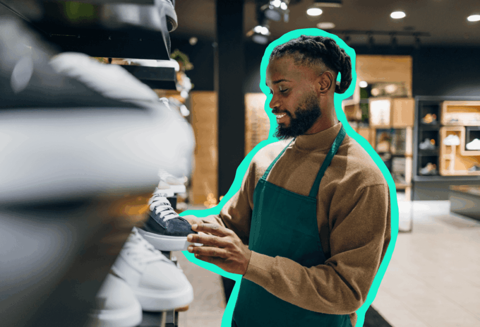 Black man in an apron working in a store