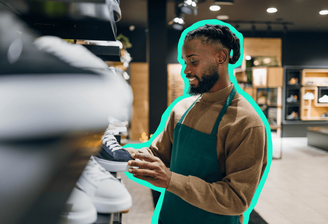 Black man in an apron working in a store