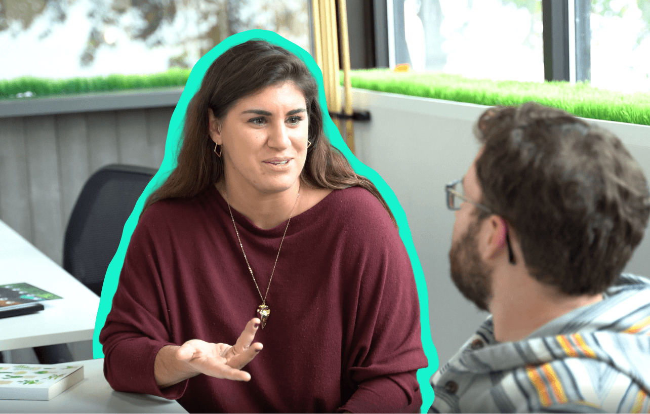 Woman talking with a man in a conference room