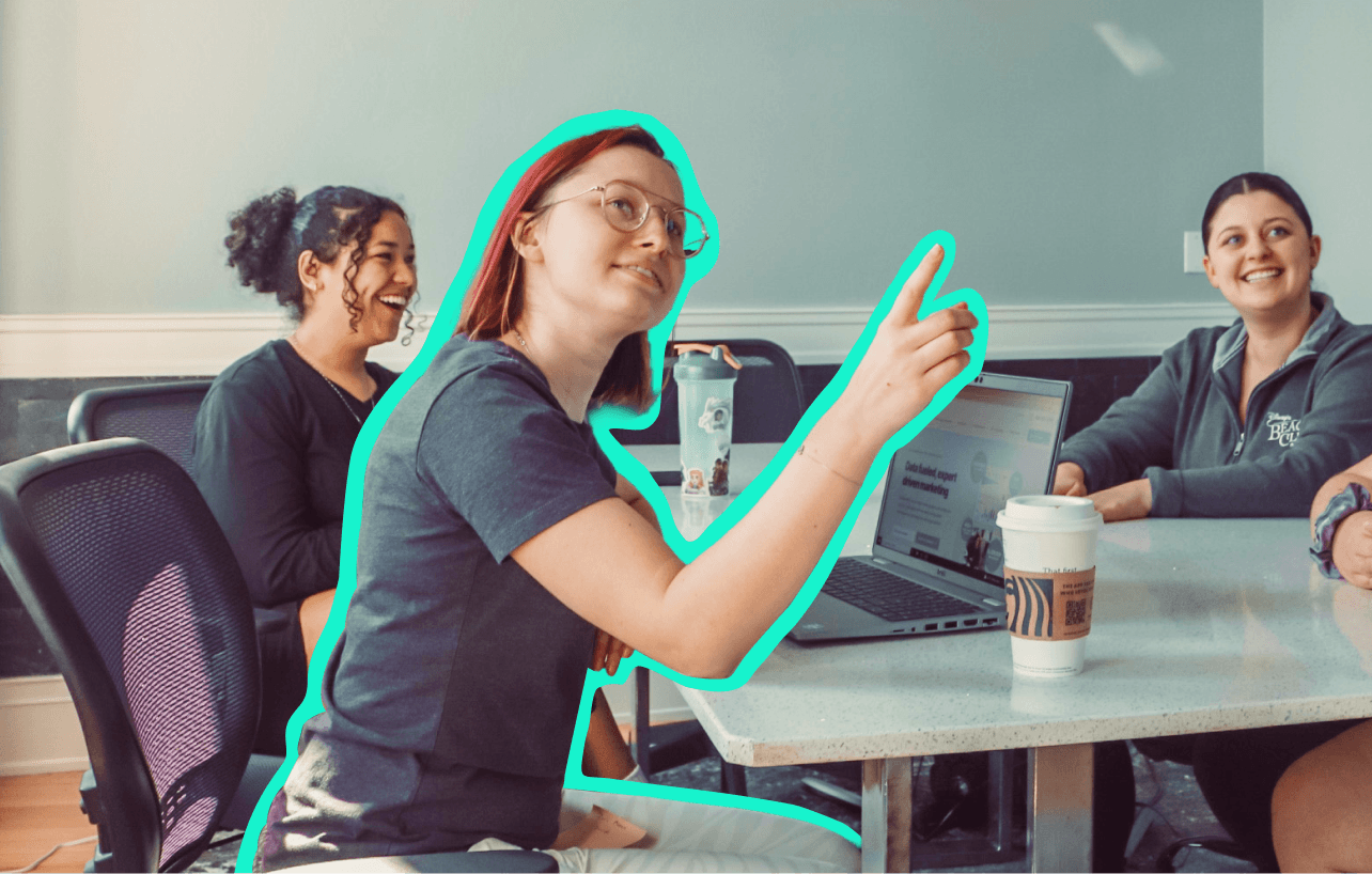 Woman with glasses pointing up