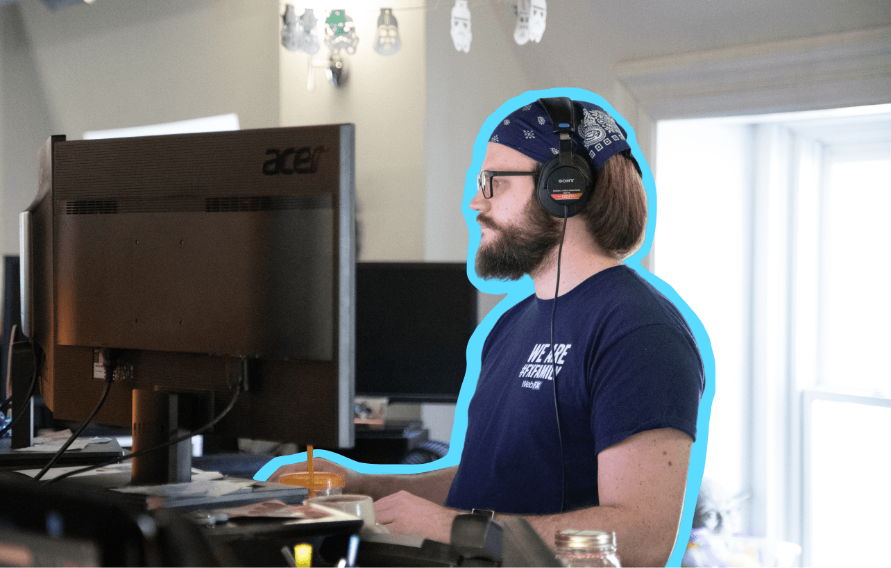 Man standing at a computer